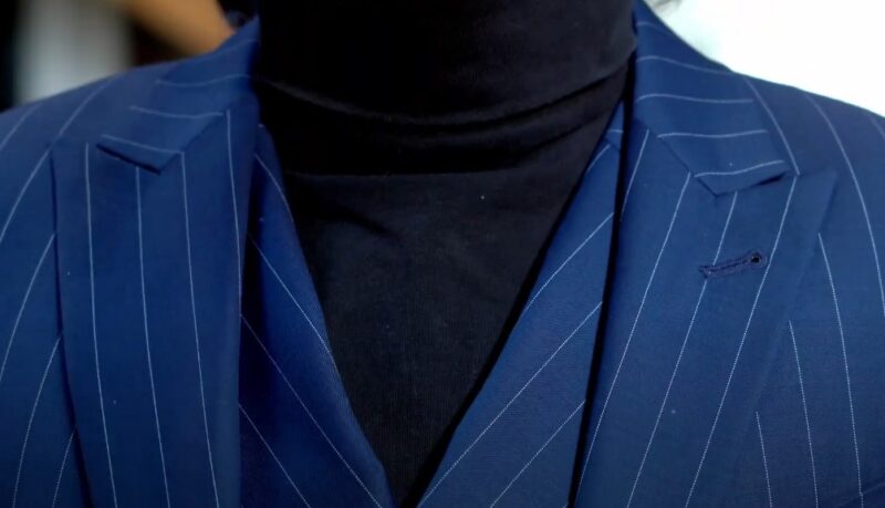 Blue pinstripe suit with black turtleneck