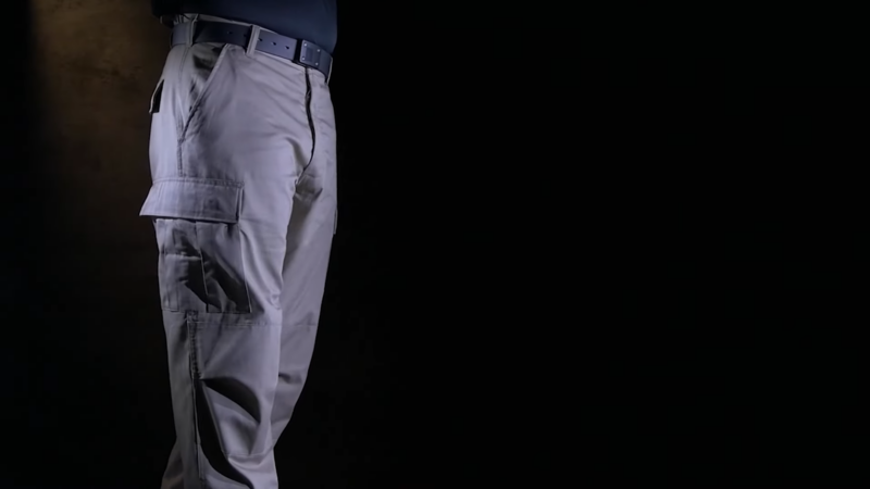 A Person Wearing Tactical Cargo Pants and A Black Shirt, Showcasing the Side View of The Outfit