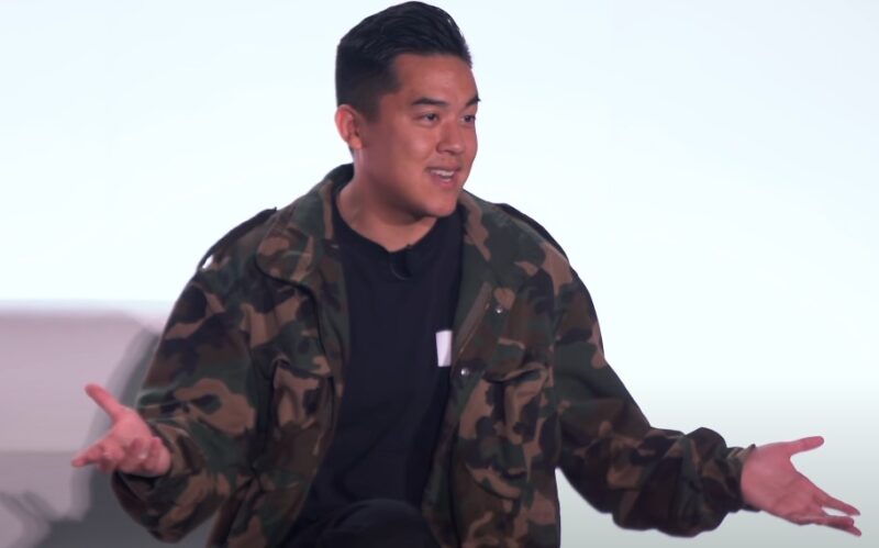 Bobby Hundreds in camouflage jacket, delivering a presentation