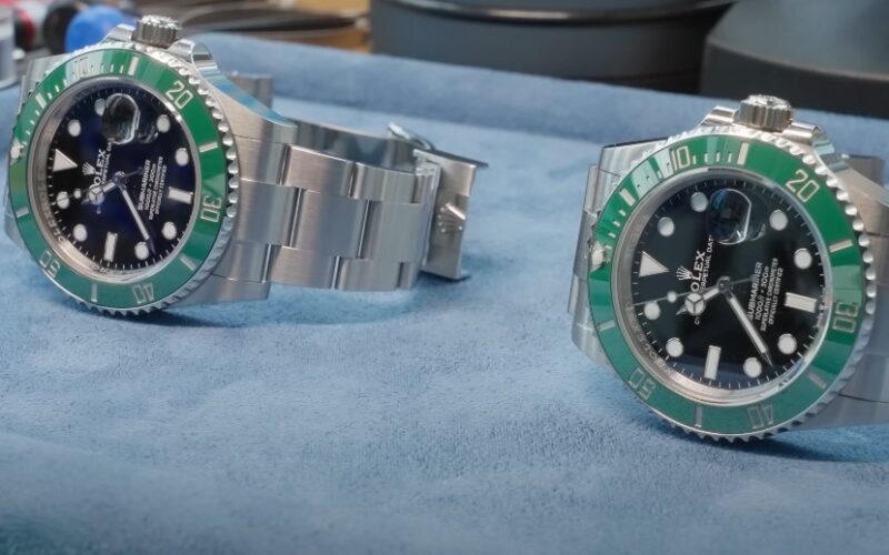Two Rolex Submariner watches, showcasing the iconic green bezel and stainless steel bands
