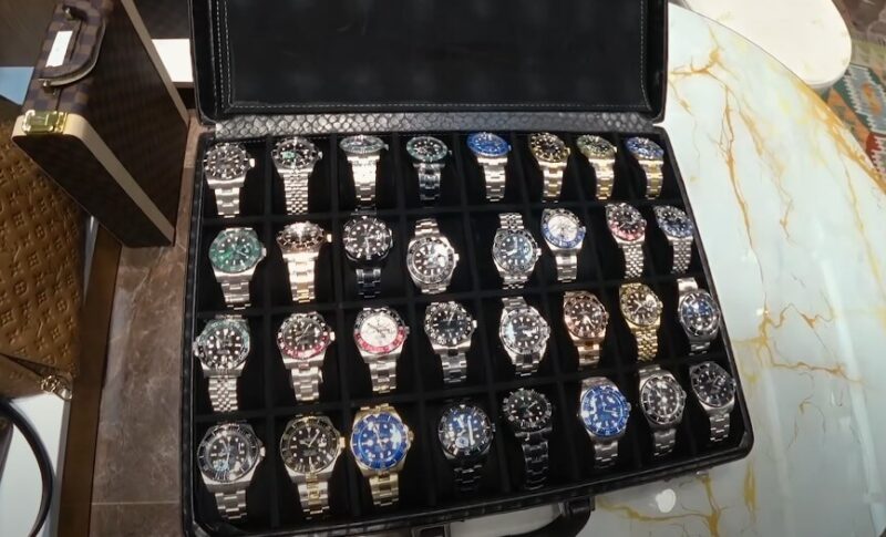 A curated collection of timepieces, meticulously arranged in a stylish case