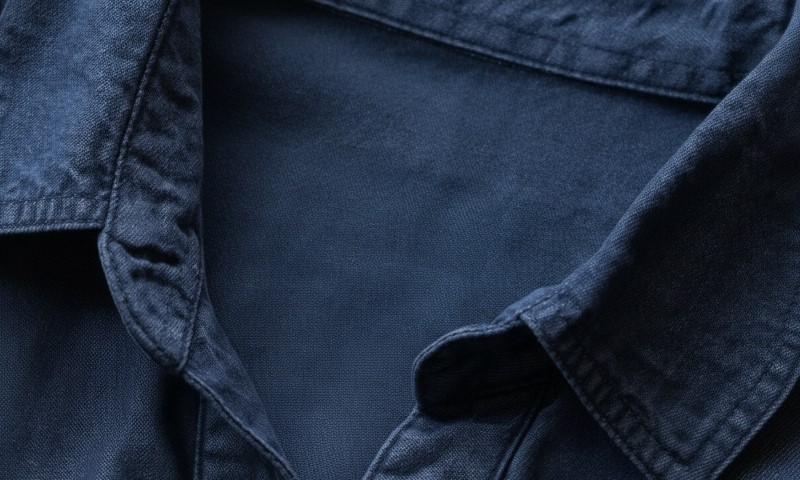 Close-up of a dark blue tencel shirt fabric